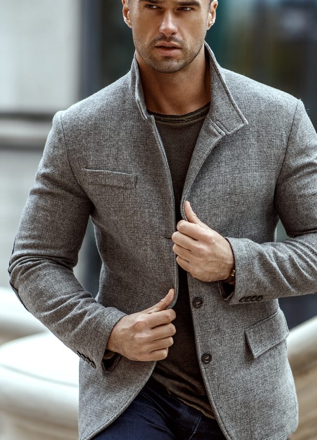 Handsome man in fashinable outfit walking